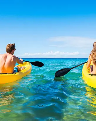 Couple kayaking in clear water